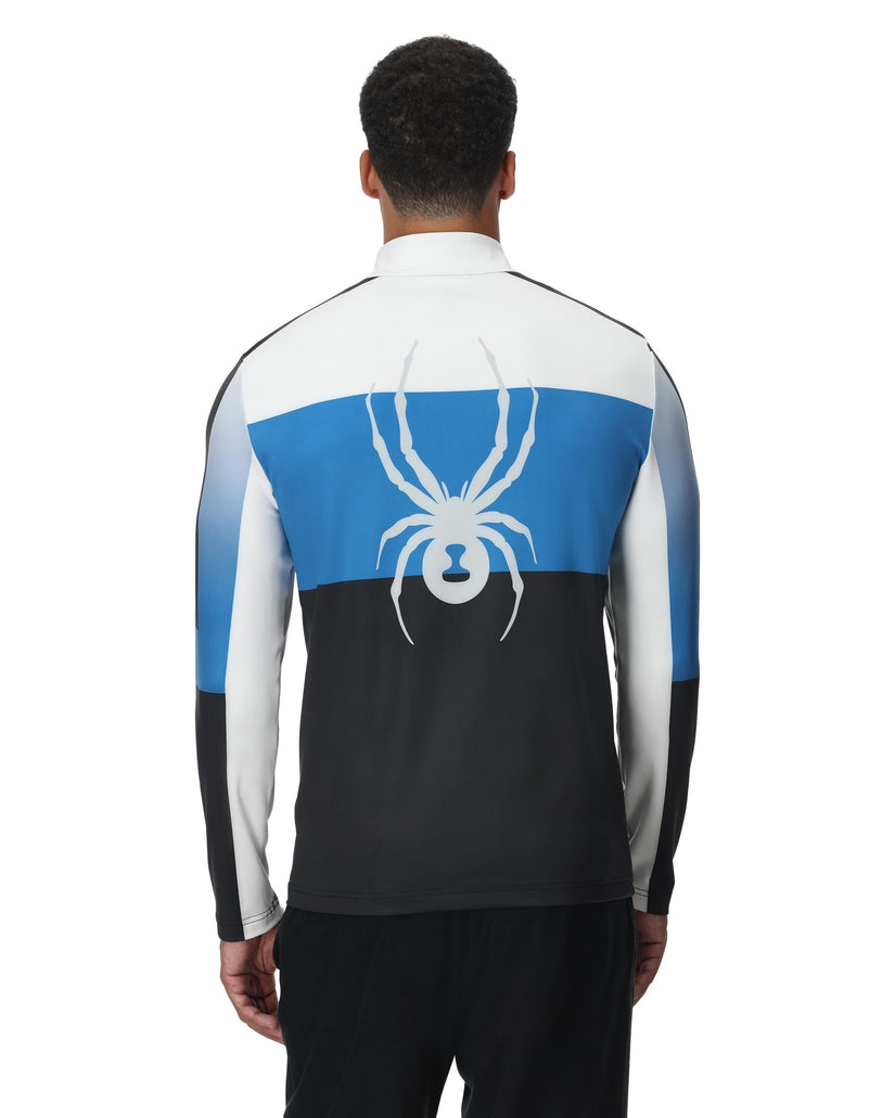 Person wearing a jacket with a spider logo on the back, featuring blue and black sections.