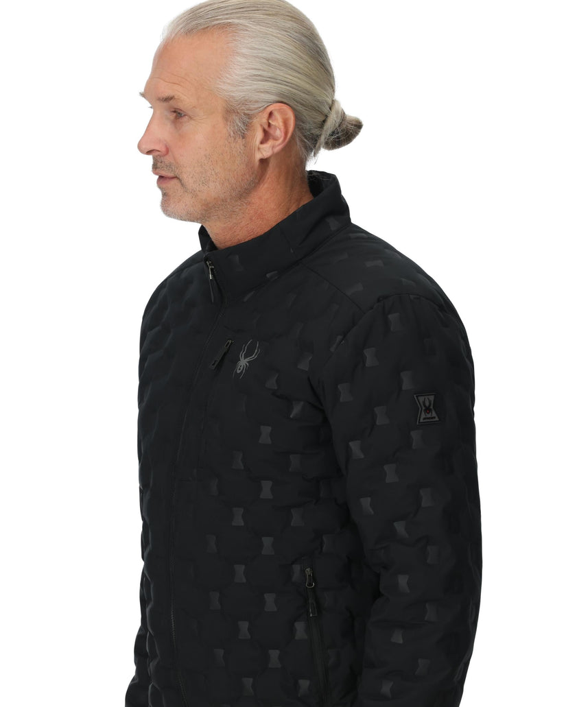 Man wearing a black patterned jacket on a white background