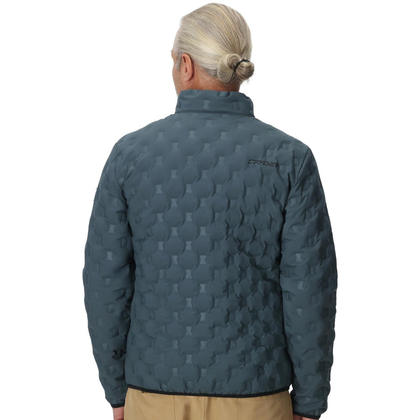 Person wearing a textured blue jacket on a white background