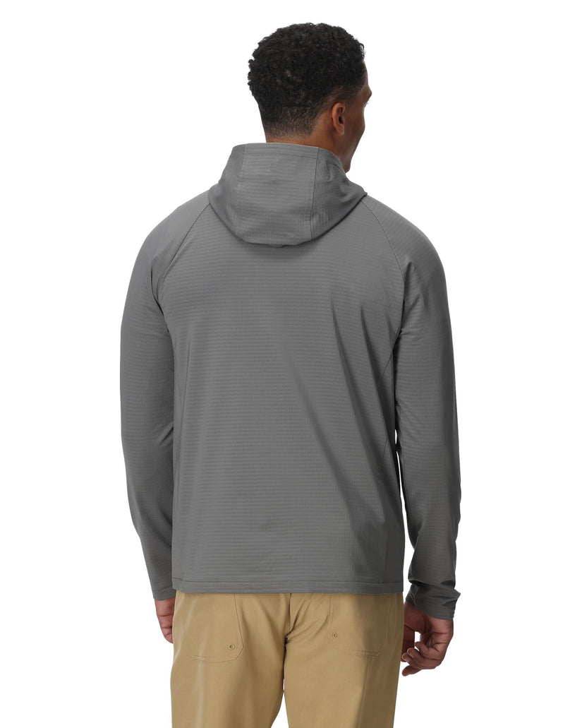 Man wearing a gray hooded jacket on a white background