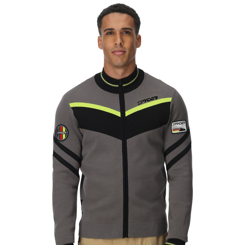Man wearing a gray jacket with black and yellow accents on a white background