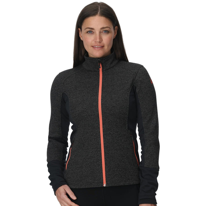 Woman wearing a dark gray jacket with a red zipper on a white background