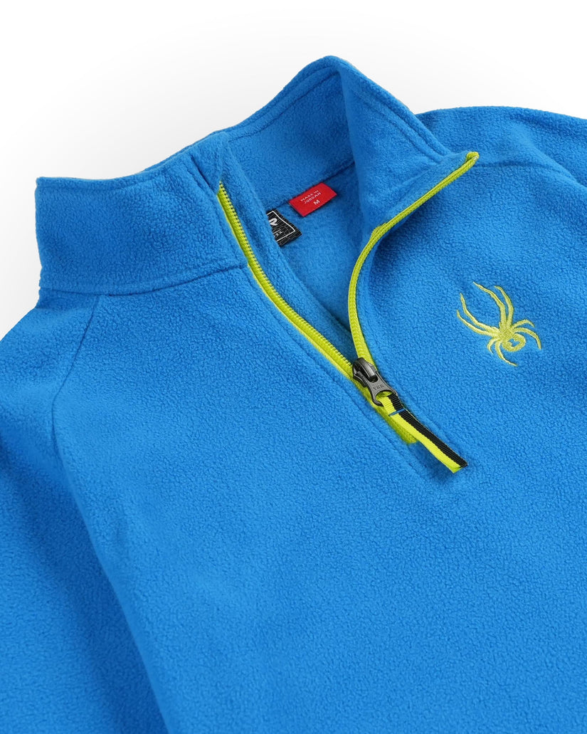 Blue fleece pullover with yellow zipper and logo on a white background