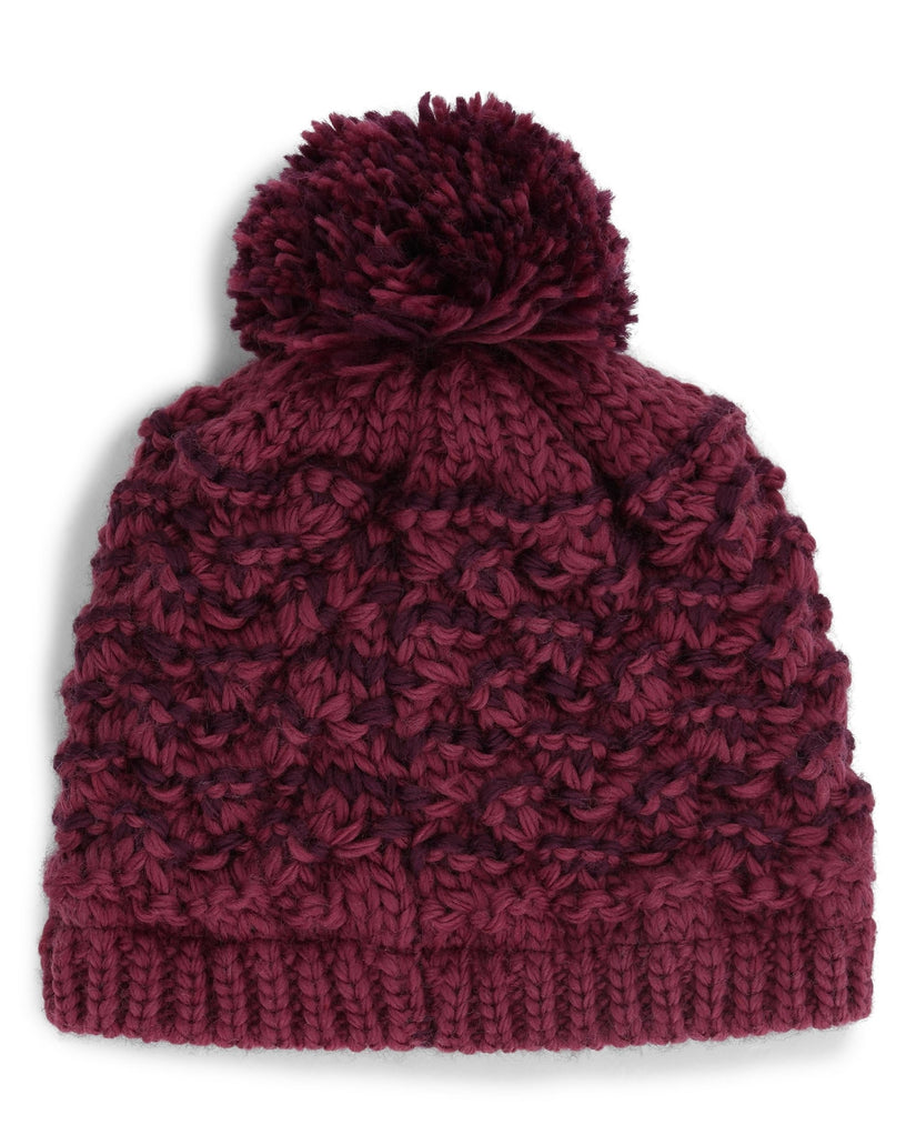 Maroon knit beanie with pom-pom on a white background