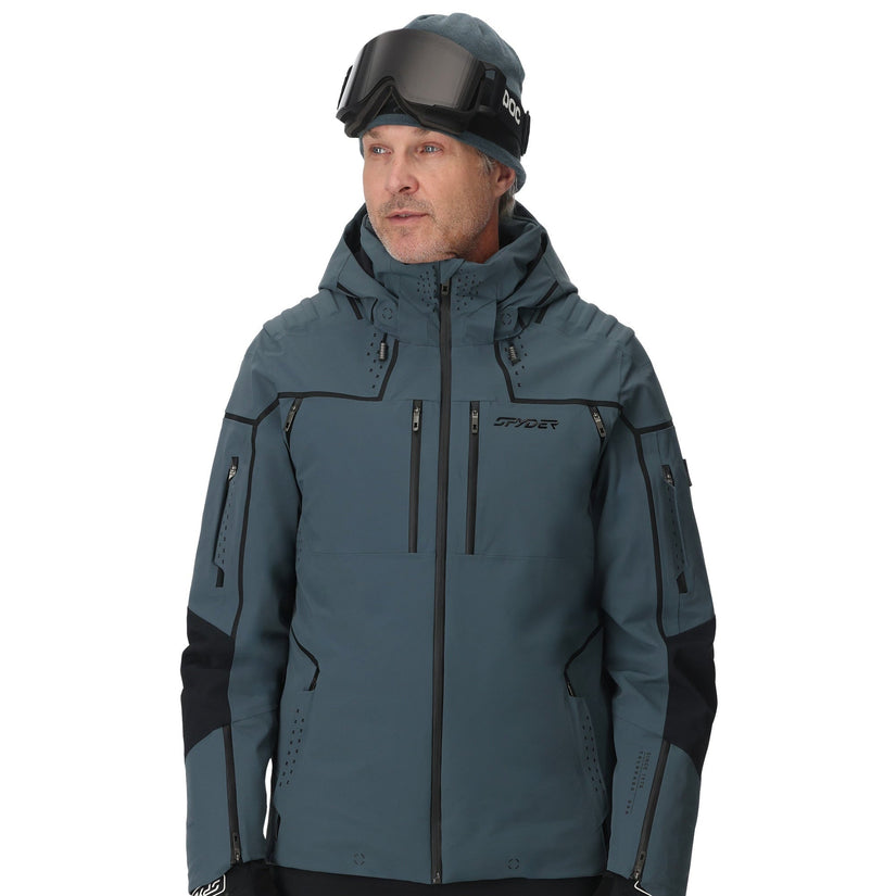 Man wearing a gray ski jacket with black accents on a white background