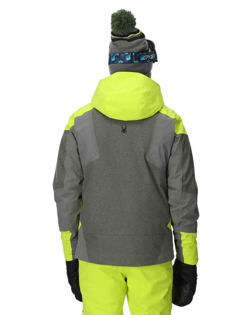 Person wearing a gray and neon green jacket with a matching hat and pants on a white background