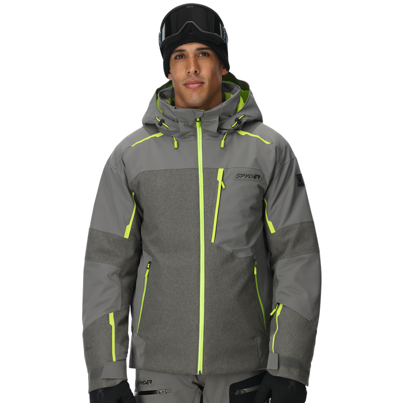 Person wearing a gray ski jacket with green accents on a white background
