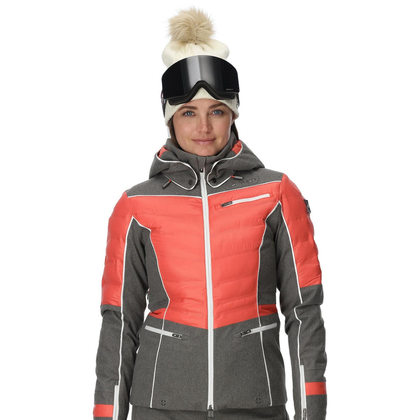 Person wearing a red and gray ski jacket with goggles on a white background