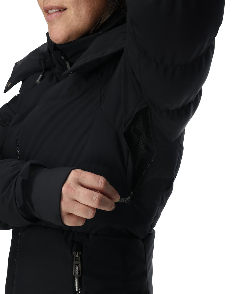 Close-up of a person wearing a black jacket with a hood on a white background