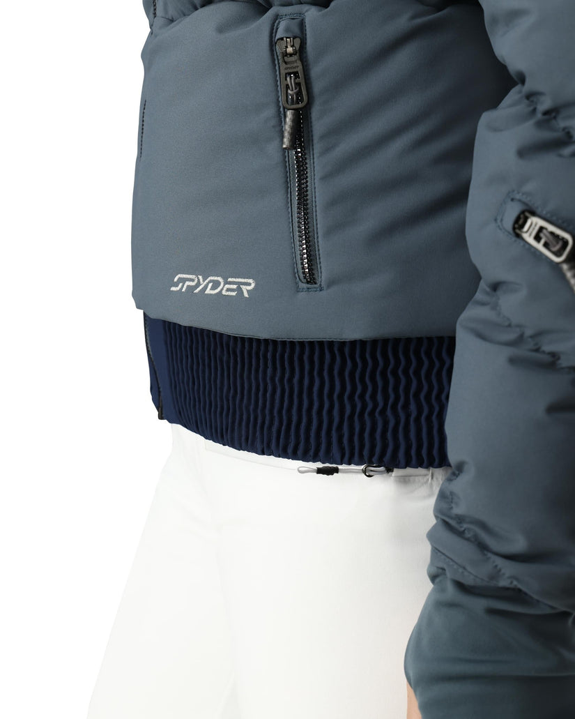 Close-up of a blue Spyder ski jacket on a white background