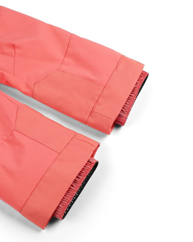 Close-up of red pants with pleated details on a white background