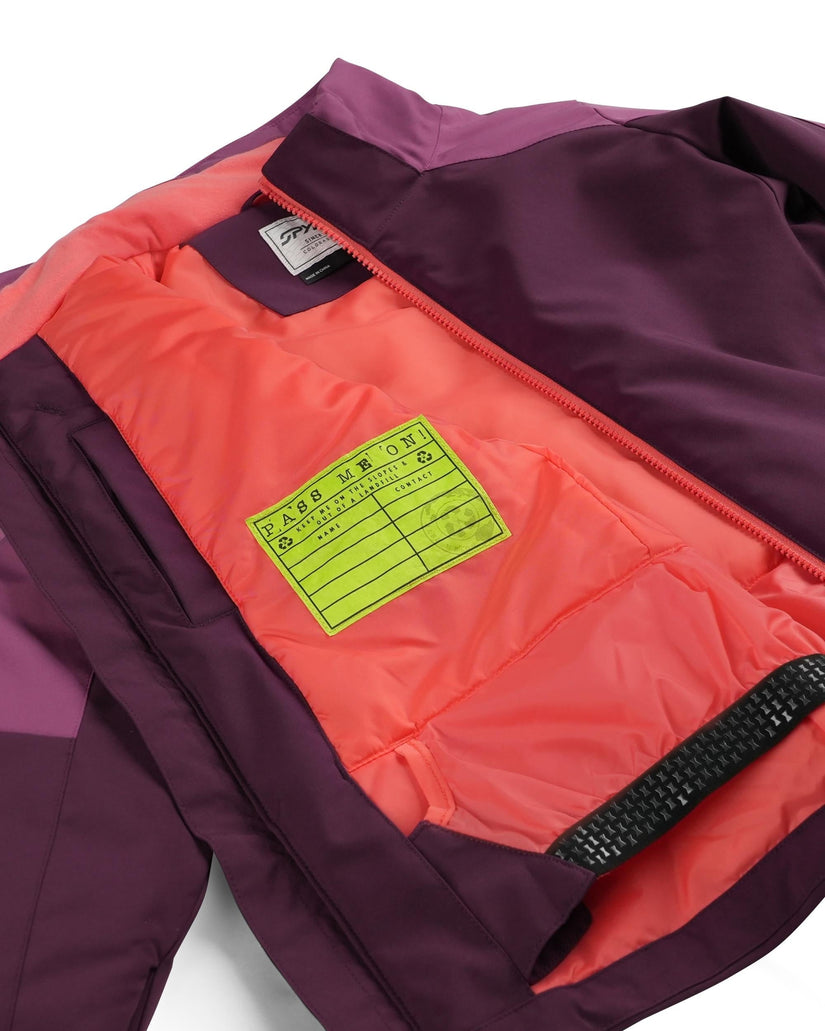 Close-up of a jacket with a visible brand label on a white background