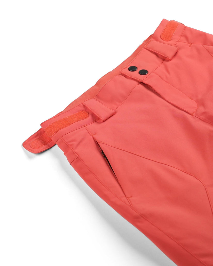 Close-up of orange shorts with a white background
