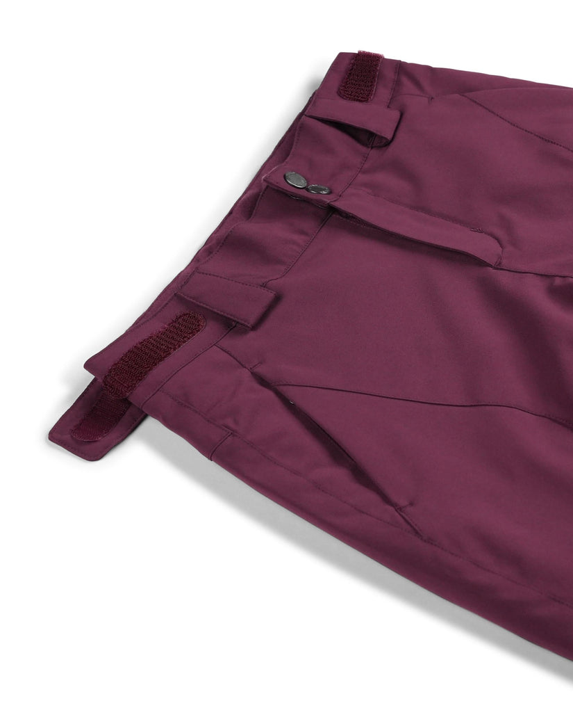 Close-up of maroon pants with a button on a white background